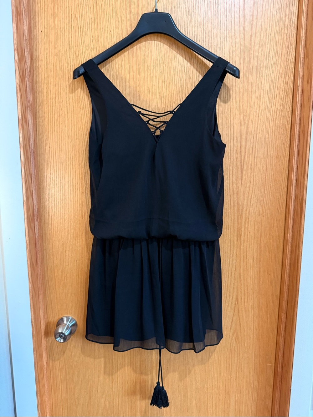 Likely Black Sleeveless Mini Dress with Lace-Up Back
